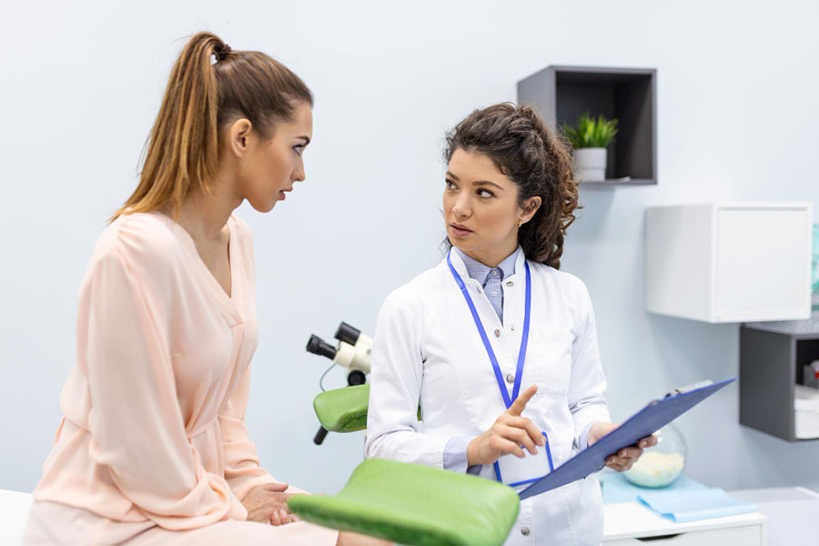 gynecologist-is-examined-by-patient-who-is-sitting-gynecological-chair-examination-by-gynecologist-female-health-concept-Annual-Gynecological-Exam Annual Gynecological Exam