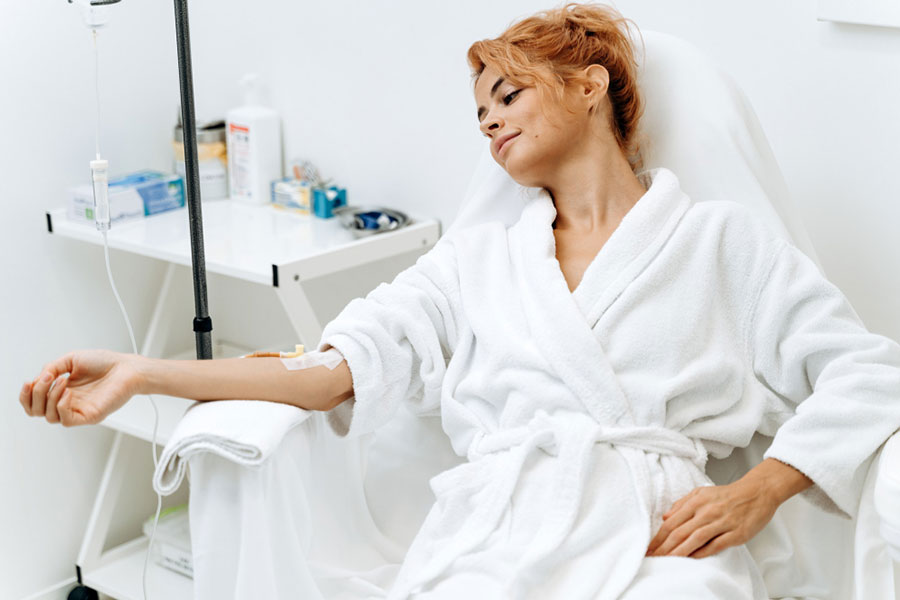 portrait-mindful-woman-sitting-armchair-closed-eyes-while-receiving-iv-infusion-with-vitamins-cosmetology-medicine-concept-IV-Therapy-Miami